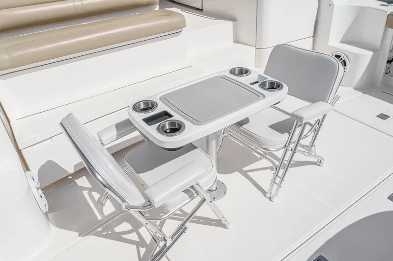 Slide: The Image of Tiara Yachts 43 Open 2018, seating area with table and chairs. - 13