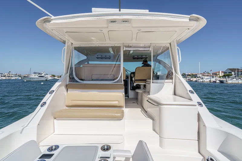 Slide: The Image of 2018 Tiara Yachts 43 Open on water, interior cockpit view. - 18