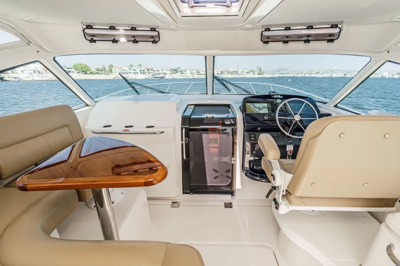 Slide: The Image of Interior of 2018 Tiara Yachts 43 Open with helm and table. - 22