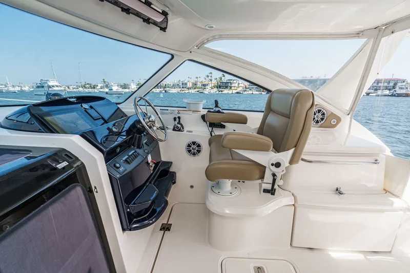 Slide: The Image of Interior of 2018 Tiara Yachts 43 Open with helm station. - 24
