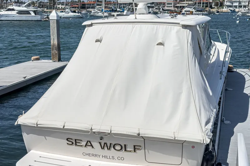 Slide: The Image of 2018 Tiara Yachts 43 Open at dock, covered. - 28