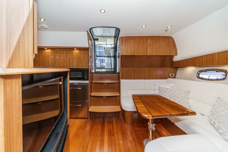 Slide: The Image of Interior of 2018 Tiara Yachts 43 Open with wooden furnishings. - 33