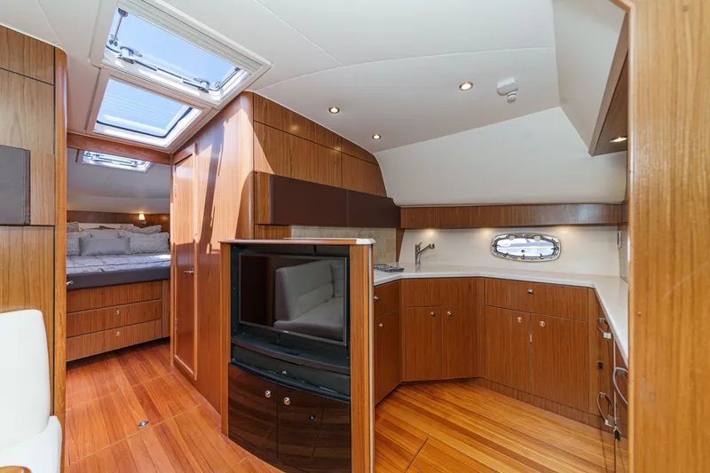 Slide: The Image of Interior of 2018 Tiara Yachts 43 Open with wood finish. - 37