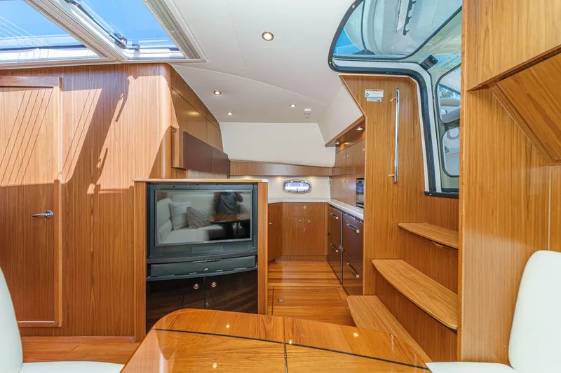 Slide: The Image of Interior of 2018 Tiara Yachts 43 Open with wood finish. - 38