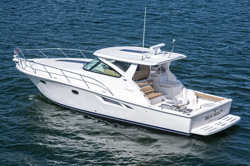 Slide: The Image of 2018 Tiara Yachts 43 Open on water, side view. - 4