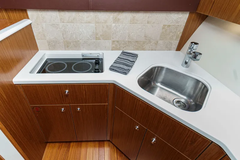 Slide: The Image of Tiara Yachts 43 Open 2018 kitchen area with sink and stove. - 40