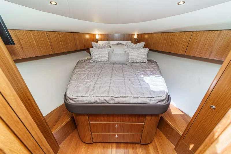 Slide: The Image of Luxurious cabin of 2018 Tiara Yachts 43 Open with wooden furnishings. - 43