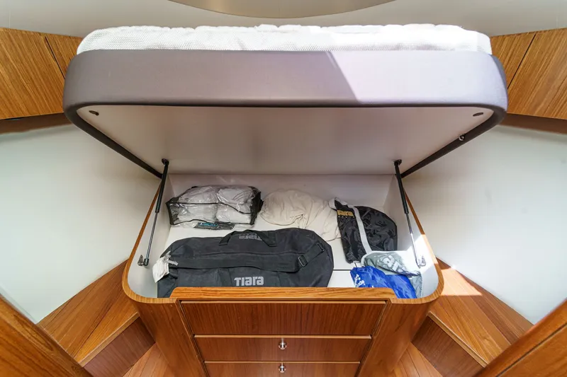 Slide: The Image of Under-bed storage in a 2018 Tiara Yachts 43 Open. - 44