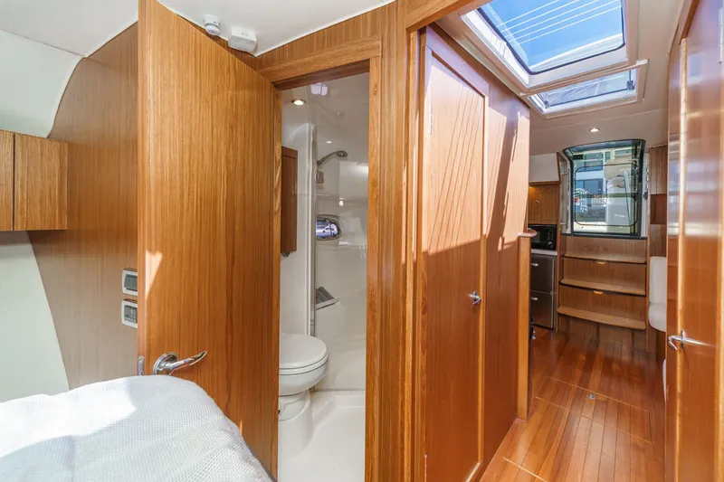 Slide: The Image of Interior of 2018 Tiara Yachts 43 Open with wood finish. - 46