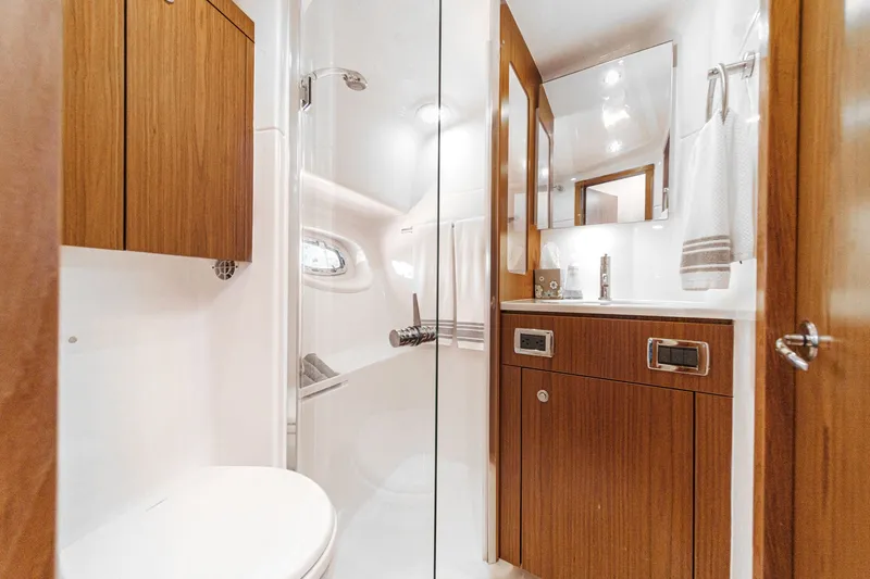 Slide: The Image of Luxurious bathroom in a 2018 Tiara Yachts 43 Open yacht. - 47