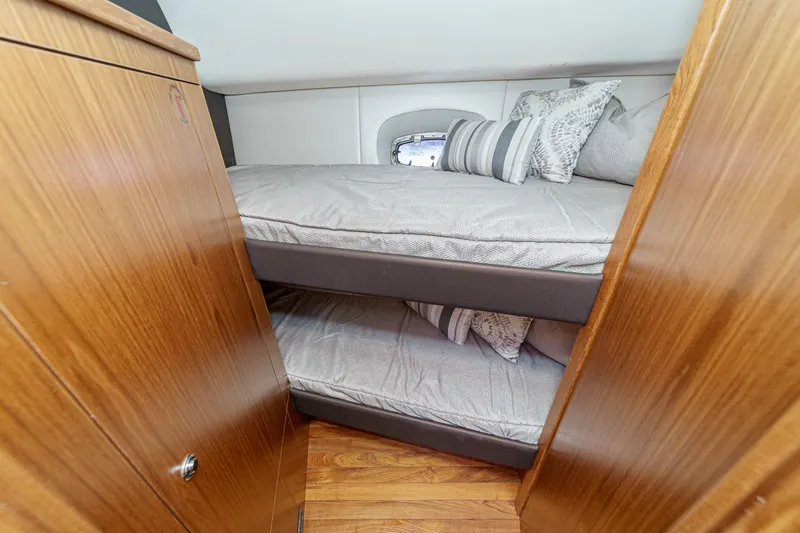 Slide: The Image of Interior of 2018 Tiara Yachts 43 Open with bunk beds. - 48