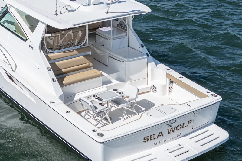 Slide: The Image of 2018 Tiara Yachts 43 Open on water, luxurious deck layout. - 8