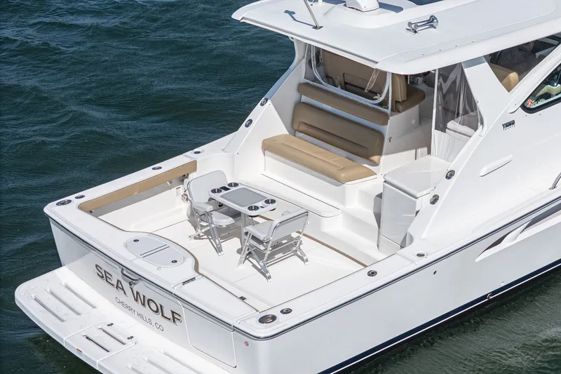 Slide: The Image of 2018 Tiara Yachts 43 Open on water, luxurious deck design. - 9