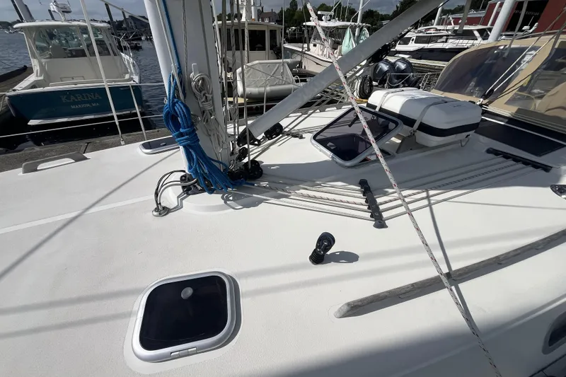 Slide: The Image of 2017 Rustler 37 sailboat deck with rigging and equipment at marina. - 10