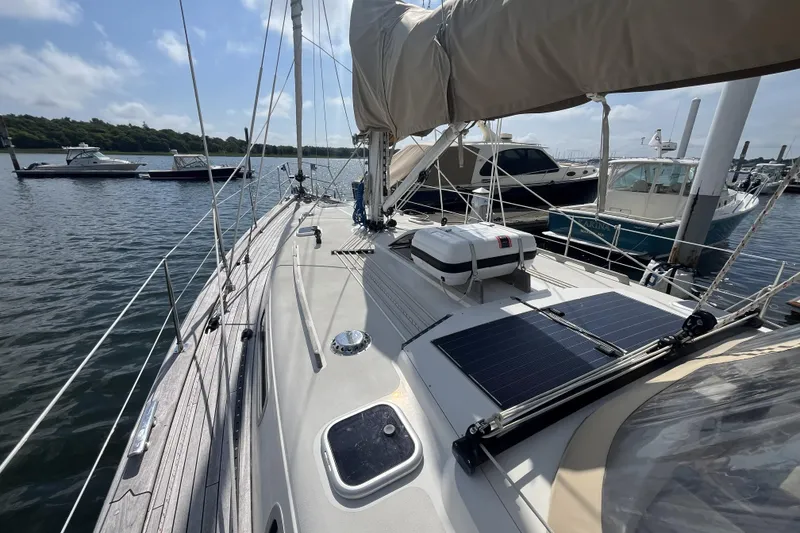 Slide: The Image of Sailboat Rustler 37, 2017 model, docked with solar panels on deck. - 11