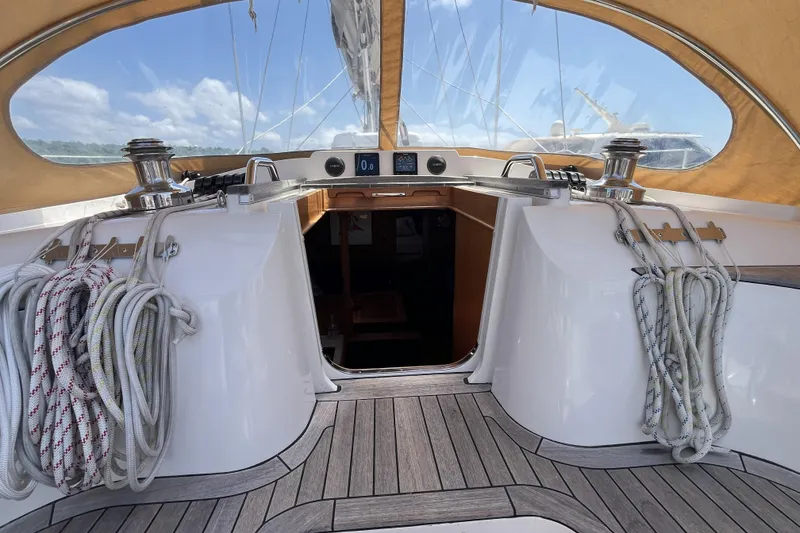 Slide: The Image of Cockpit of 2017 Rustler 37 sailboat with ropes and winches under a sunny sky. - 14