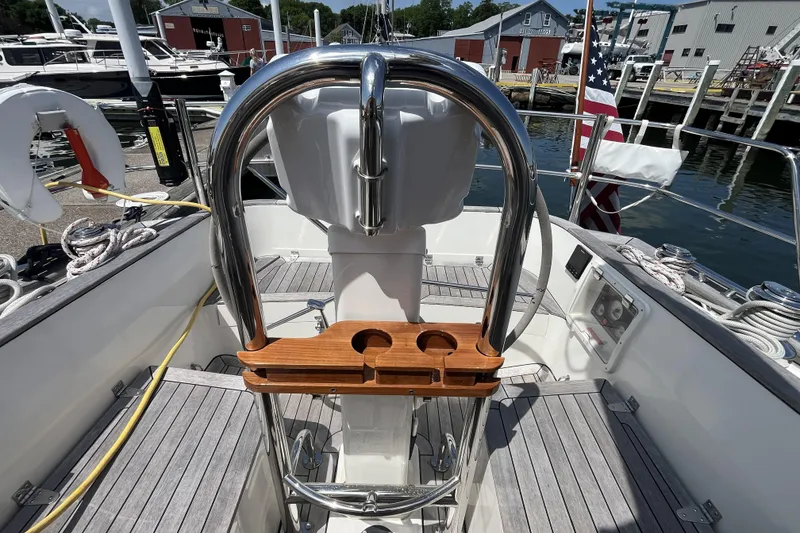 Slide: The Image of Cockpit of 2017 Rustler 37 sailboat with steering wheel and wooden cup holder. - 15