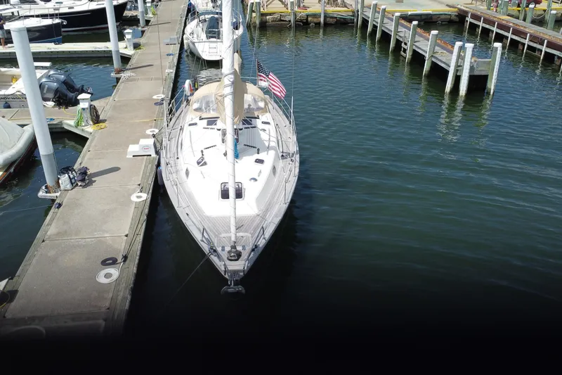 Slide: The Image of 2017 Rustler 37 sailboat docked at marina, aerial view. - 2
