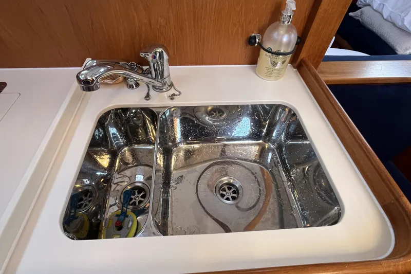 Slide: The Image of Stainless steel sink in 2017 Rustler 37 yacht galley with chrome faucet and soap dispenser. - 30