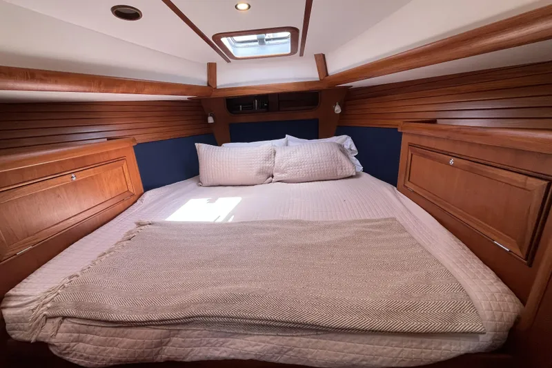 Slide: The Image of Cozy cabin interior of 2017 Rustler 37 yacht with wooden finish and skylight. - 38
