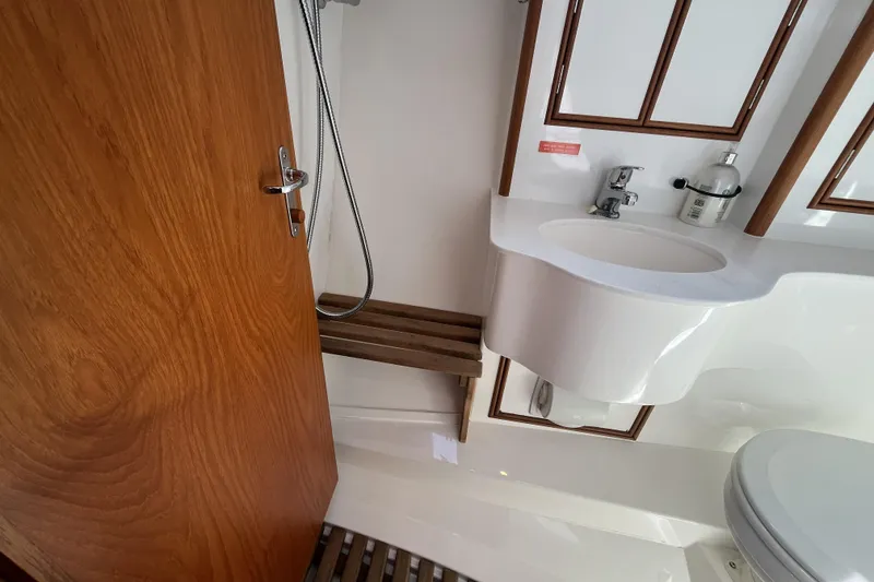 Slide: The Image of Bathroom interior of 2017 Rustler 37 yacht with wooden accents and modern fixtures. - 46