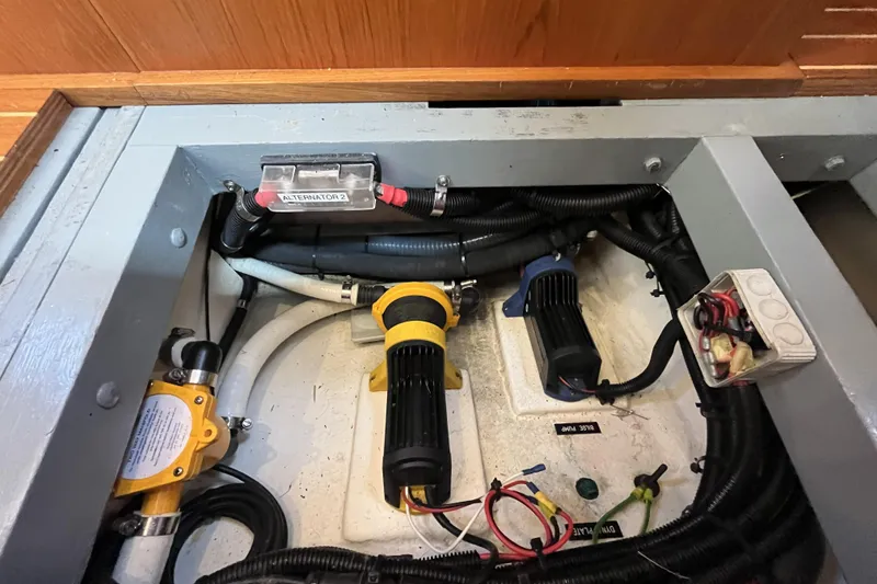 Slide: The Image of Engine compartment of a 2017 Rustler 37 yacht, featuring wiring and components. - 61