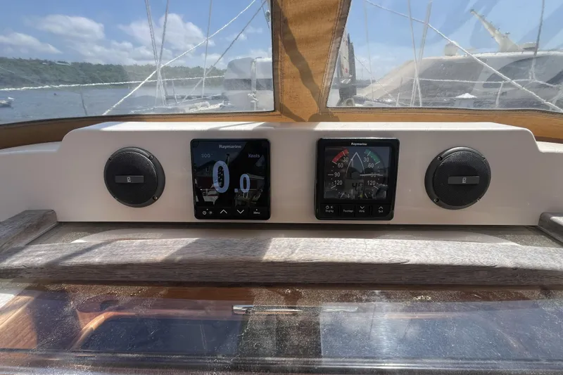 Slide: The Image of Cockpit of 2017 Rustler 37 sailboat with navigation instruments and speakers. - 63
