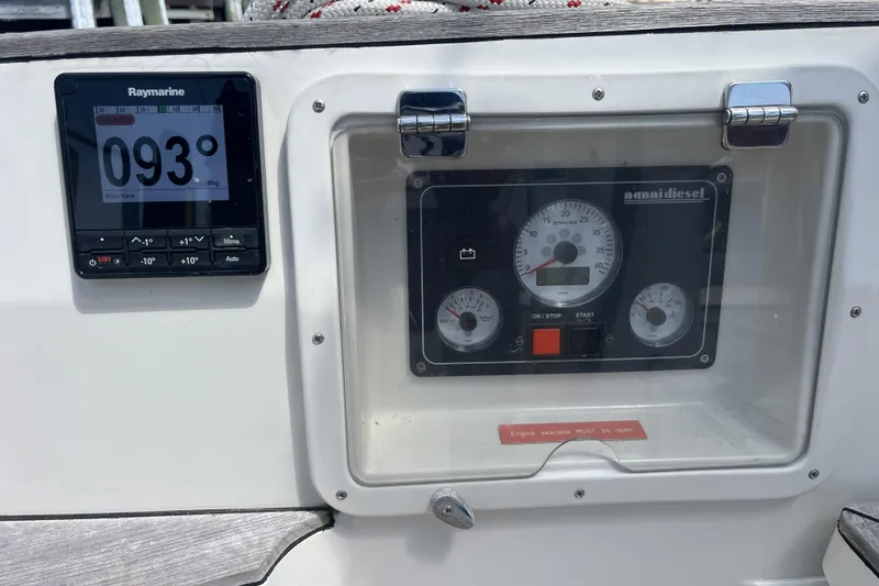 Slide: The Image of Boat dashboard with Raymarine display and Nanni Diesel engine controls, Rustler 37, 2017 model. - 65