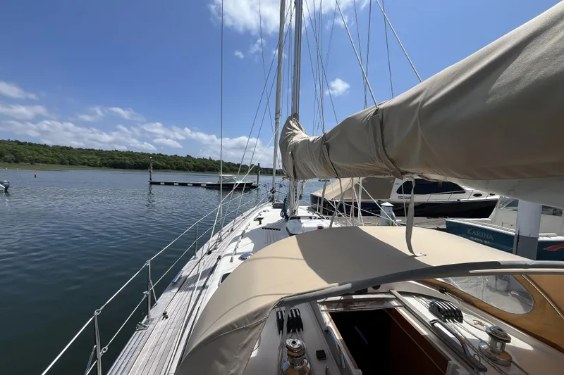 Slide: The Image of Sailboat Rustler 37 (2017) docked at marina under clear blue sky. - 67
