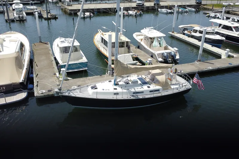 Slide: The Image of 2017 Rustler 37 sailboat docked at marina with other boats. - 73