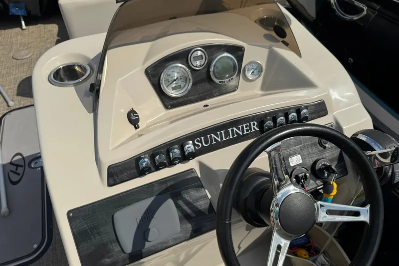 Slide: The Image of 2017 Harris FloteBote 240 Sunliner dashboard with steering wheel and controls. - 11