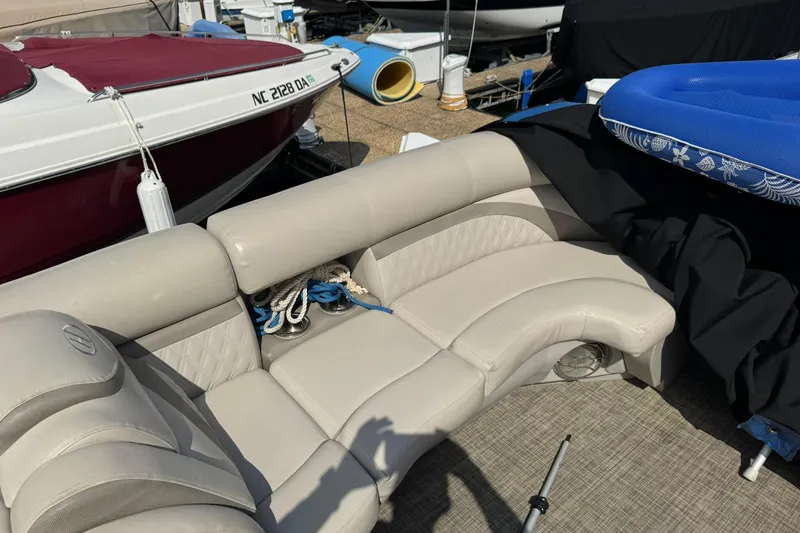 Slide: The Image of 2017 Harris FloteBote 240 Sunliner with beige seating and nautical accessories. - 13