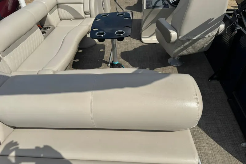 Slide: The Image of Interior of 2017 Harris FloteBote 240 Sunliner with beige seating and table. - 18