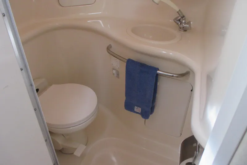 Slide: The Image of Bathroom interior of 1997 Sea Ray Sundancer 330 yacht with toilet and sink. - 20