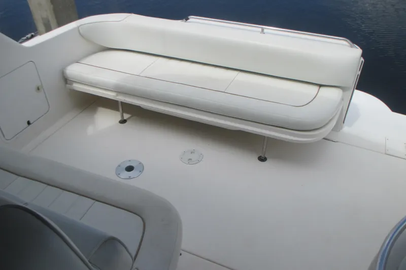 Slide: The Image of White seating area on a 1997 Sea Ray Sundancer 330 boat deck. - 9