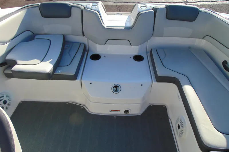 Slide: The Image of 2019 Yamaha Boats AR190 interior seating area with cup holders and cushioned seats. - 12