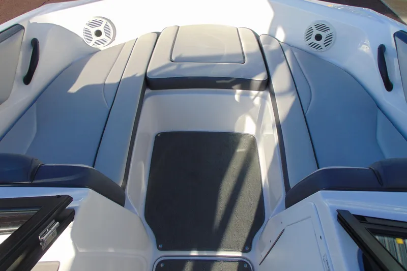 Slide: The Image of 2019 Yamaha Boats AR190 interior with cushioned seating and built-in speakers. - 13