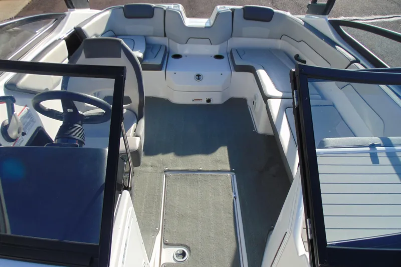 Slide: The Image of 2019 Yamaha Boats AR190 interior with seating and steering wheel, showcasing spacious design. - 14
