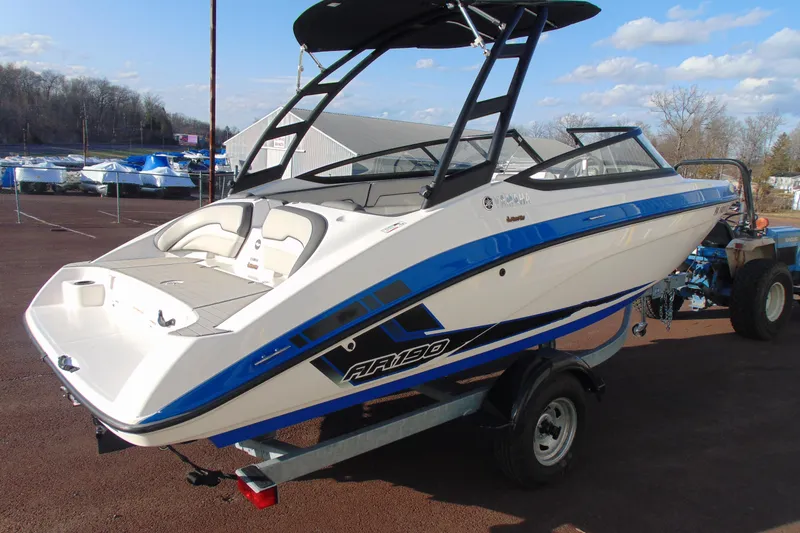 Slide: The Image of 2019 Yamaha Boats AR190 on trailer, featuring sleek blue and white design. - 3