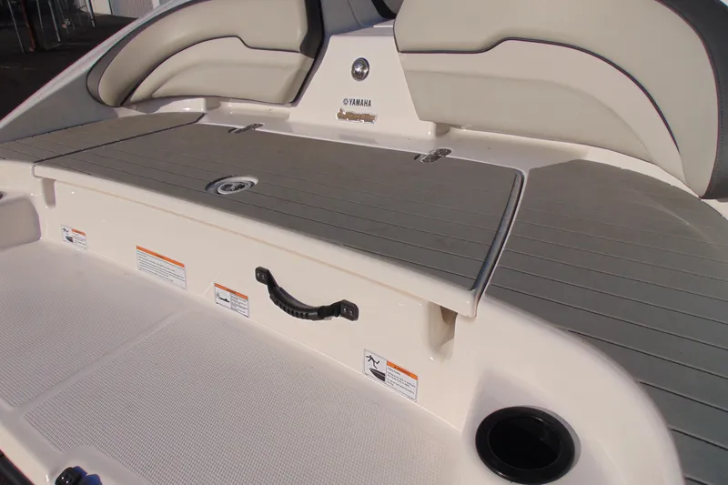 Slide: The Image of 2019 Yamaha Boats AR190 swim platform with cushioned seating and storage. - 4