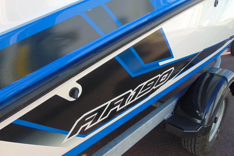 Slide: The Image of 2019 Yamaha Boats AR190 with blue and black graphics on trailer. - 5