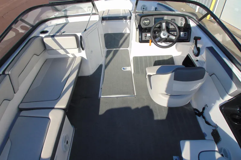 Slide: The Image of 2019 Yamaha Boats AR190 interior with seating, steering wheel, and dashboard. - 7