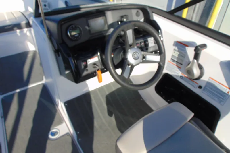 Slide: The Image of 2019 Yamaha Boats AR190 cockpit with steering wheel and control panel. - 8