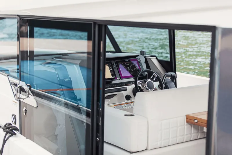 Slide: The Image of The image shows the cockpit of a 2027 Saxdor 340 GTWA with modern instruments and a sleek steering wheel. - 7