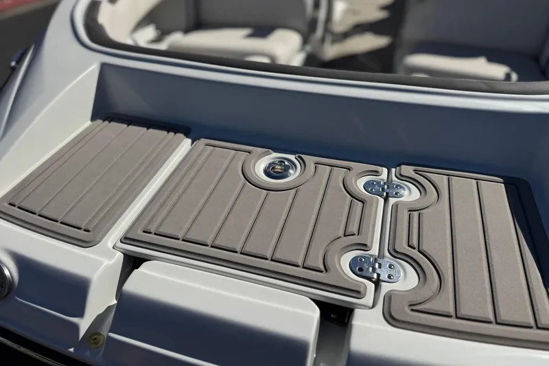 Slide: The Image of 2020 Crownline Eclipse E255 SURF boat deck with gray padded surface. - 10