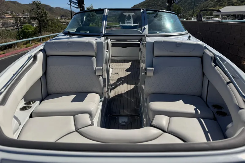 Slide: The Image of 2020 Crownline Eclipse E255 SURF boat interior with luxurious seating and sleek design. - 14