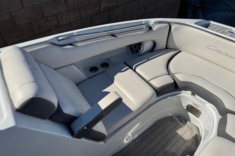 Slide: The Image of 2020 Crownline Eclipse E255 SURF boat interior with plush seating and cup holders. - 16