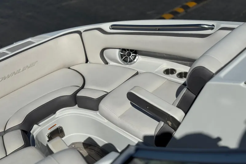 Slide: The Image of 2020 Crownline Eclipse E255 SURF boat interior with plush seating and cup holders. - 17