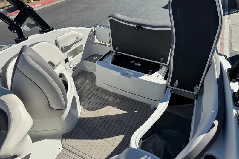 Slide: The Image of 2020 Crownline Eclipse E255 SURF boat interior with open storage compartments. - 25