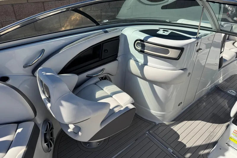 Slide: The Image of 2020 Crownline Eclipse E255 SURF boat interior with sleek seating and modern dashboard. - 29
